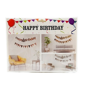 Gold foiled Happy Birthday banner set in packaging showing indoor party decoration