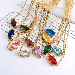 Colorful marquise-cut gemstone necklaces with gold box chains in various vibrant colors