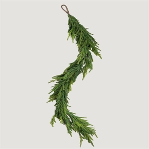Detailed macro view of artificial PE pine garland with realistic green needles and hook