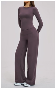 Detailed texture of dusty purple brushed fabric on yoga top and wide leg pants