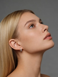 Detailed close-up of S925 sterling silver square hoop earrings with a brushed matte texture