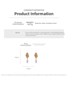 Detailed view of vintage conch earrings with pearls showing dimensions 8.6cm by 2.3cm