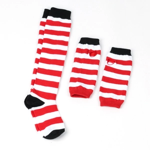 Detail of red and white striped knit over-knee socks and arm warmers with black cuffs