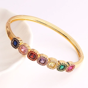 Gold-plated copper bangle featuring multi-color square gemstones and micro-pave detailing