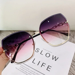 Frameless rimless sunglasses with gradient purple pink lenses and gold metal frame