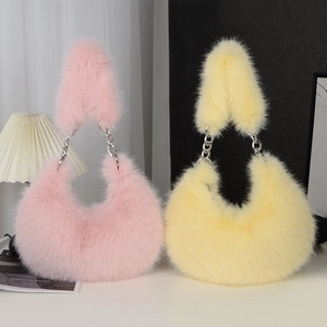 Fuzzy faux fur crescent crossbody bag in pink and yellow with silver metal chain straps