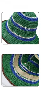 Close-up of handmade striped straw hat showing top weave texture and inner sweatband detail
