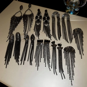Collection of black rhinestone tassel earrings in teardrop and geometric styles