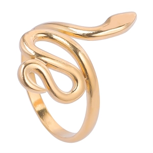 Macro shot of gold snake ring featuring a detailed wrap-around design and polished finish