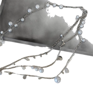 Double-layer silver waist chain with shell, pearl tassels, and elegant metal charms