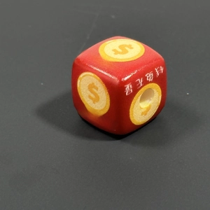 Macro shot of red wooden charm bead featuring money symbols and Chinese calligraphy