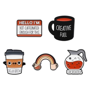 Creative coffee enamel pin set with cartoon designs and slogans like Deja Brew on white background