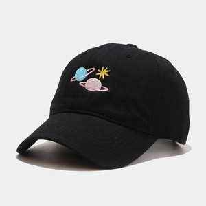 Detail of colorful planet embroidery on black cotton twill baseball cap with curved brim