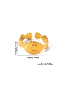 Detail of 18k gold plated titanium steel ring with oval relief and dimensions 0.9cm by 1.8cm
