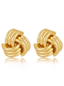 Detailed view of 18K gold-plated twisted woven knot earrings with a polished mirror finish