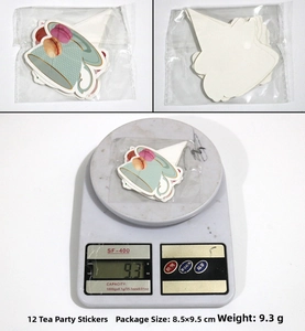Detailed view of 12-piece tea party cake toppers with dimensions and weight measurements