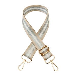 Detail of adjustable beige woven strap with sparkling silver stripes and gold metal hooks
