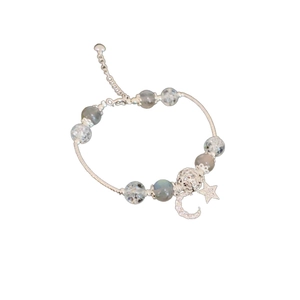 Elegant moon and star charm beaded bracelet with blue crystals and silver accents