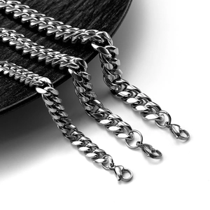 Detailed view of three polished silver Cuban link chains with secure lobster clasps