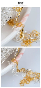 Macro detail of hollow star chain links in gold and silver plating for DIY jewelry