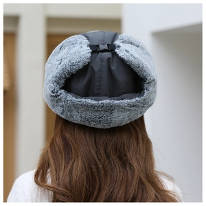 Rear view of grey winter trapper hat showing thermal faux fur and adjustable buckle