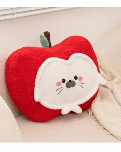 Close-up of the soft grainy fabric texture and embroidered seal face on apple plush