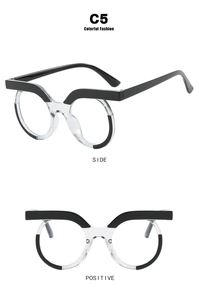Macro detail of round owl-style blue light glasses with black and clear acetate frames