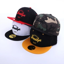 Detailed view of Brooklyn embroidered flat brim baseball caps in multiple colorways