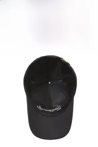 Detail view of the breathable mesh lining and brand embroidery on a black baseball cap