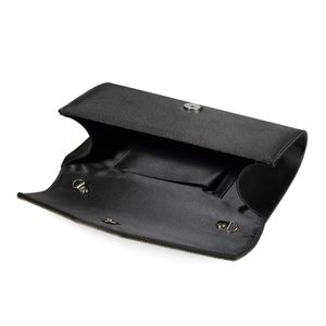 Detail of black evening clutch bag interior featuring gold D-rings and magnetic snap closure