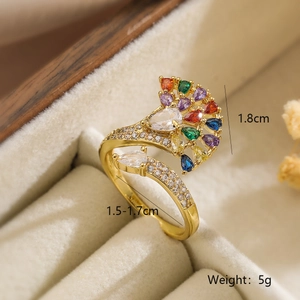 Detail of 18K gold ring with colorful peacock stones and dimension labels