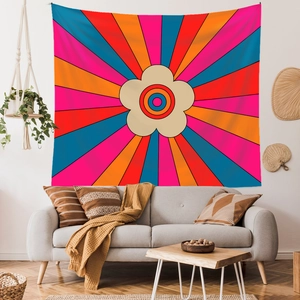 Close-up of bohemian rainbow tapestry as a cozy wall hanging above a living room sofa