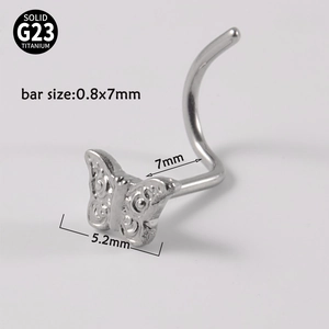 Macro detail of G23 titanium butterfly nose stud with dimensions 0.8x7mm and 5.2mm width