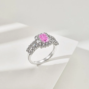 Macro shot of S925 sterling silver ring with emerald cut pink zircon and pavé diamonds