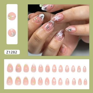 Star pattern almond press-on nails with French tip design and rhinestone accents