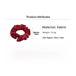 Detail showing red satin fabric scrunchie with 10cm diameter and 13.6g lightweight design