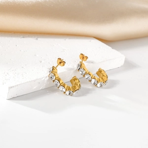 Elegant gold plated C-shaped stud earrings with sparkling cubic zirconia on stone base