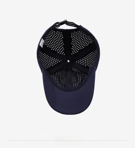 Detail of navy sun hat interior featuring breathable laser-cut holes and adjustable strap