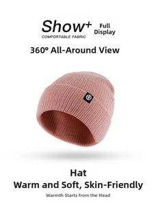 Detailed view of pink ribbed knit hat with round logo tag on a clean white background