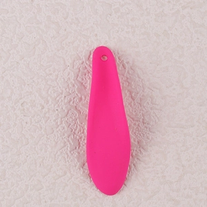 Detailed macro view of vibrant rose red teardrop-shaped acrylic petal earring accessory