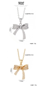 Detail of bow pendant necklace showing zircon pavé finish in gold and silver options