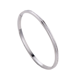 Silver-plated zircon bangle with pavé stones shown from a 45-degree angle on white background