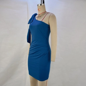 Detail of royal blue one-shoulder dress featuring bow detail and side ruching