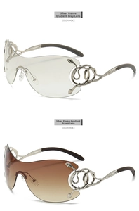 Close-up of rimless serpent sunglasses with diamond-studded temples and metal link detail