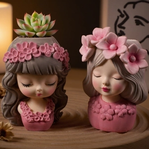 Detailed view of resin flower girl succulent pots with 3D floral crowns in soft matte finish