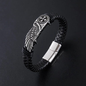 Men's black braided leather bracelet featuring silver wing and cross metal charms