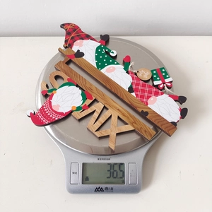 Close-up of Holy Jolly wooden Christmas gnome door frame hanger weighing 36.5 grams