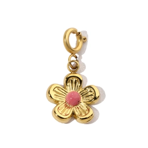 Close-up of golden five-petal flower pendant with a pink center bead on white background