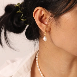French freshwater pearl twisted hoop earrings in 18k gold plated stainless steel