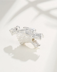 Detailed close-up of a S925 sterling silver wolf head pendant with intricate carvings